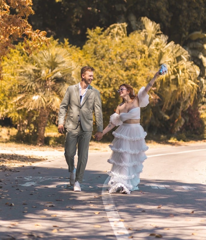 Couple celebrating on the road, wedding day