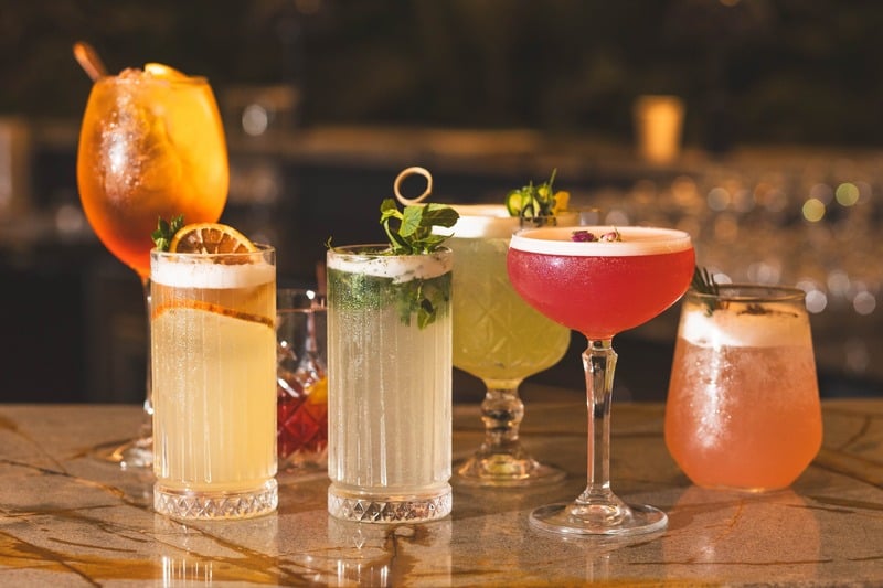 Signature cocktail lineup at golden light